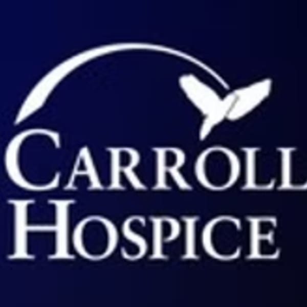 Carroll Hospice logo featuring white text and a dove against a dark blue background.